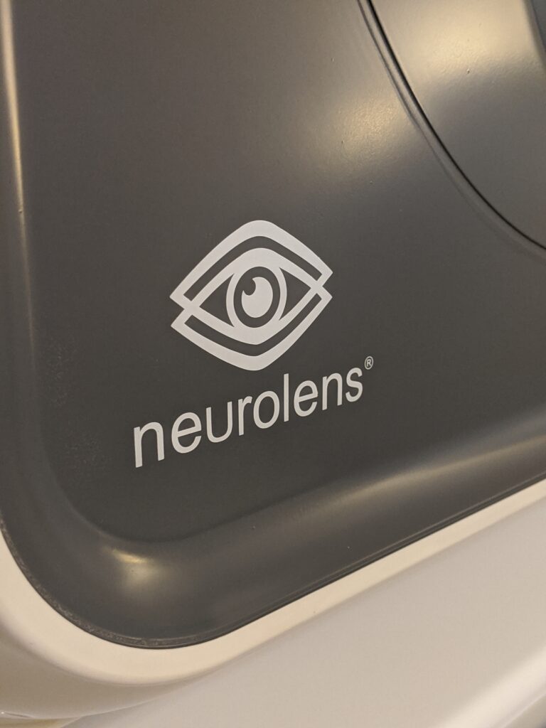 A photo of the Neurolens machine, feautring the Neurolens logo