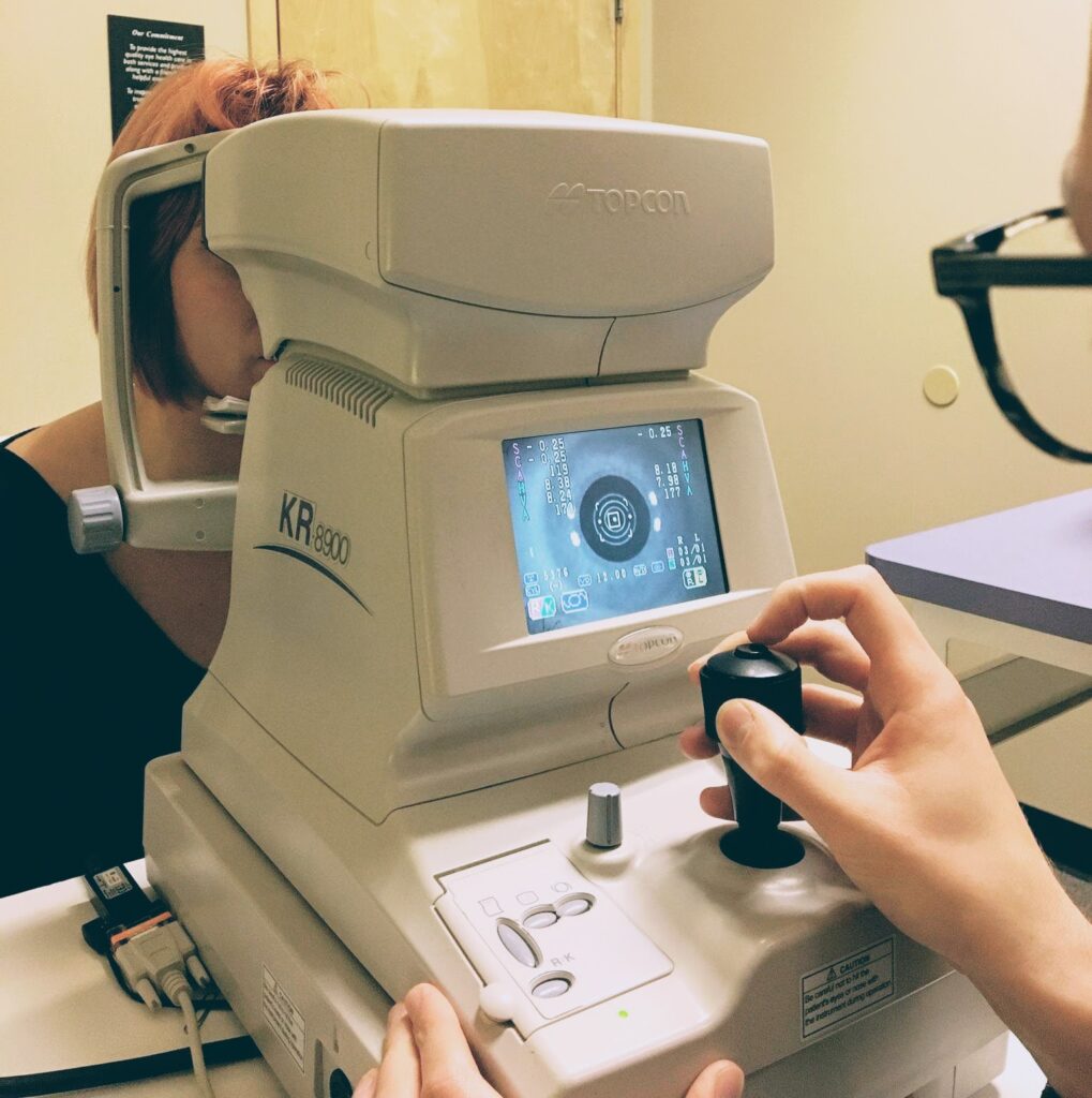 An autorefraction being performed on a patient.