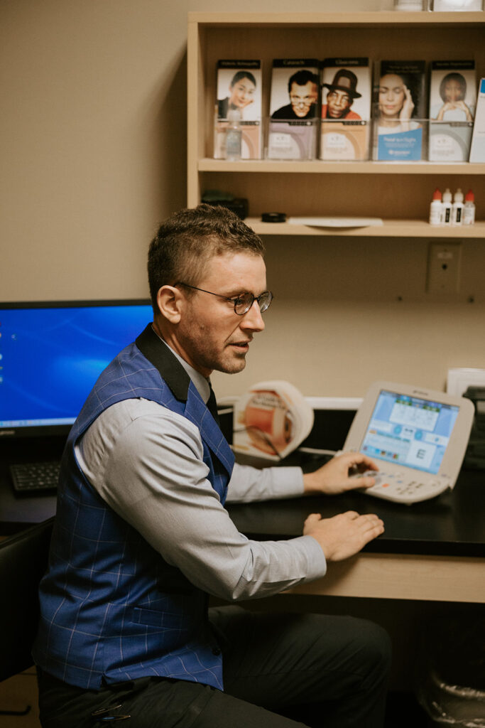 Dr. Ward adjusts the phoropter during an eye exam