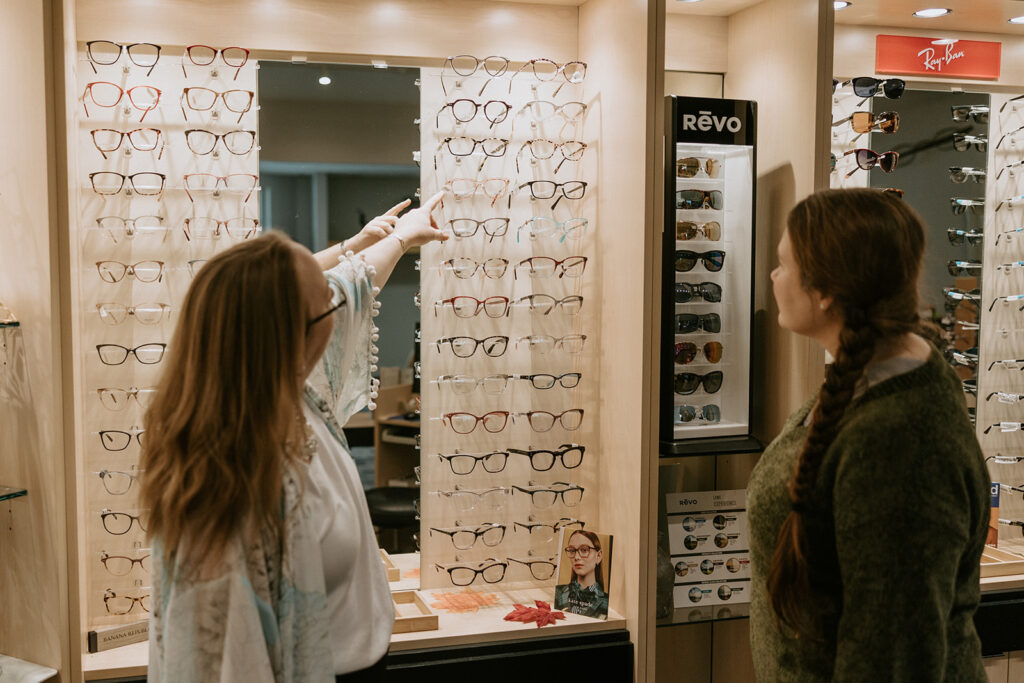 An optician helps a patient chooses frames at Valley Eye Clinic